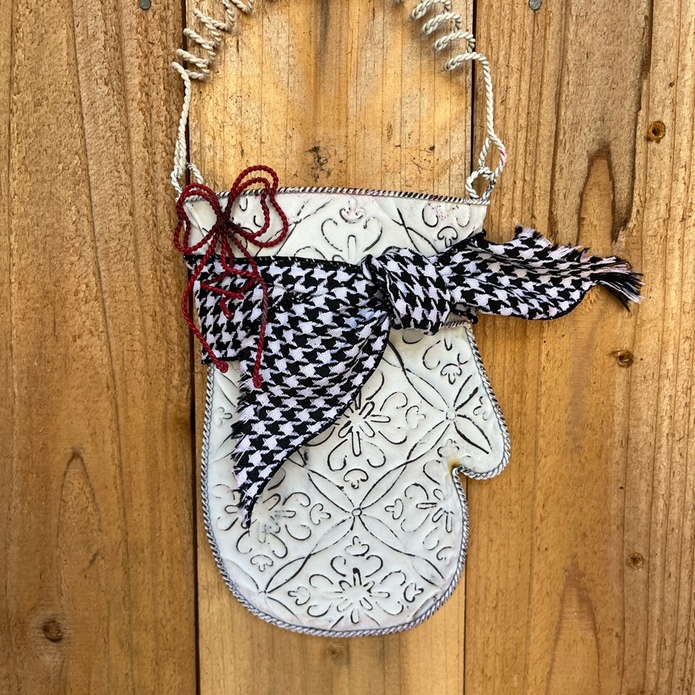 White metal Decorative Mitten with a red wire bow, houndstooth ribbon